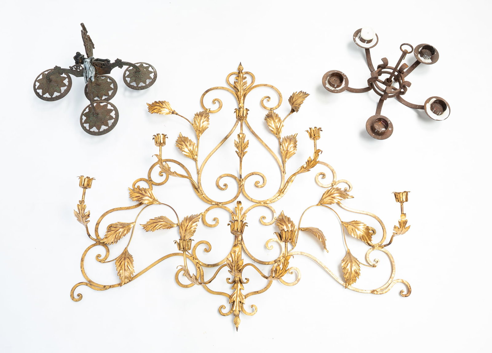 THREE IRON LIGHTING ITEMS, INCL. GILDED EIGHT-LIGHT WALL SCONCE. (1 of 4)