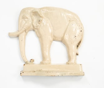 BRADLEY AND HUBBARD (MERIDEN, CONNECTICUT) WHITE-PAINTED CAST IRON ELEPHANT DOORSTOP.