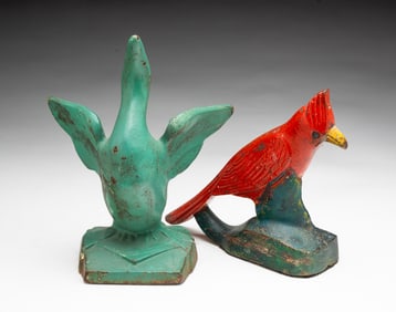 TWO AMERICAN PAINTED AND CAST IRON BIRD DOORSTOPS.