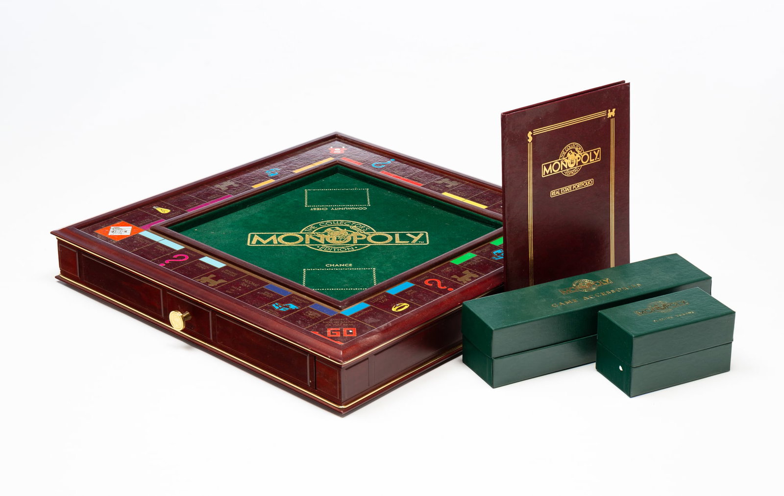 FRANKLIN MINT MONOPOLY "COLLECTOR'S EDITION" BOARD GAME IN ORIGINAL BOX.: Late 20th Century. Complete set including wooden game board with fitted drawer, all game pieces, cards, paper money, a "Real Estate portfolio," and certificate of authenticity. Gameboard, 3"h.