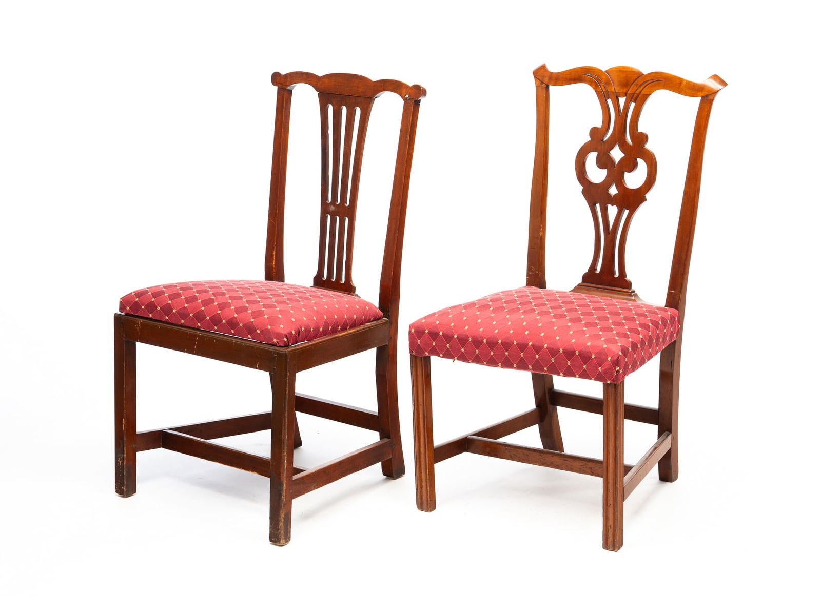 TWO AMERICAN CHIPPENDALE MAHOGANY SIDE CHAIRS.: Late 18th Century. Both with shaped crests, pierced backsplats, square legs, and box stretchers. One with fluted legs and an over-upholstered seat, 17.5" seat h. 36.5"h. And the second with upholstere