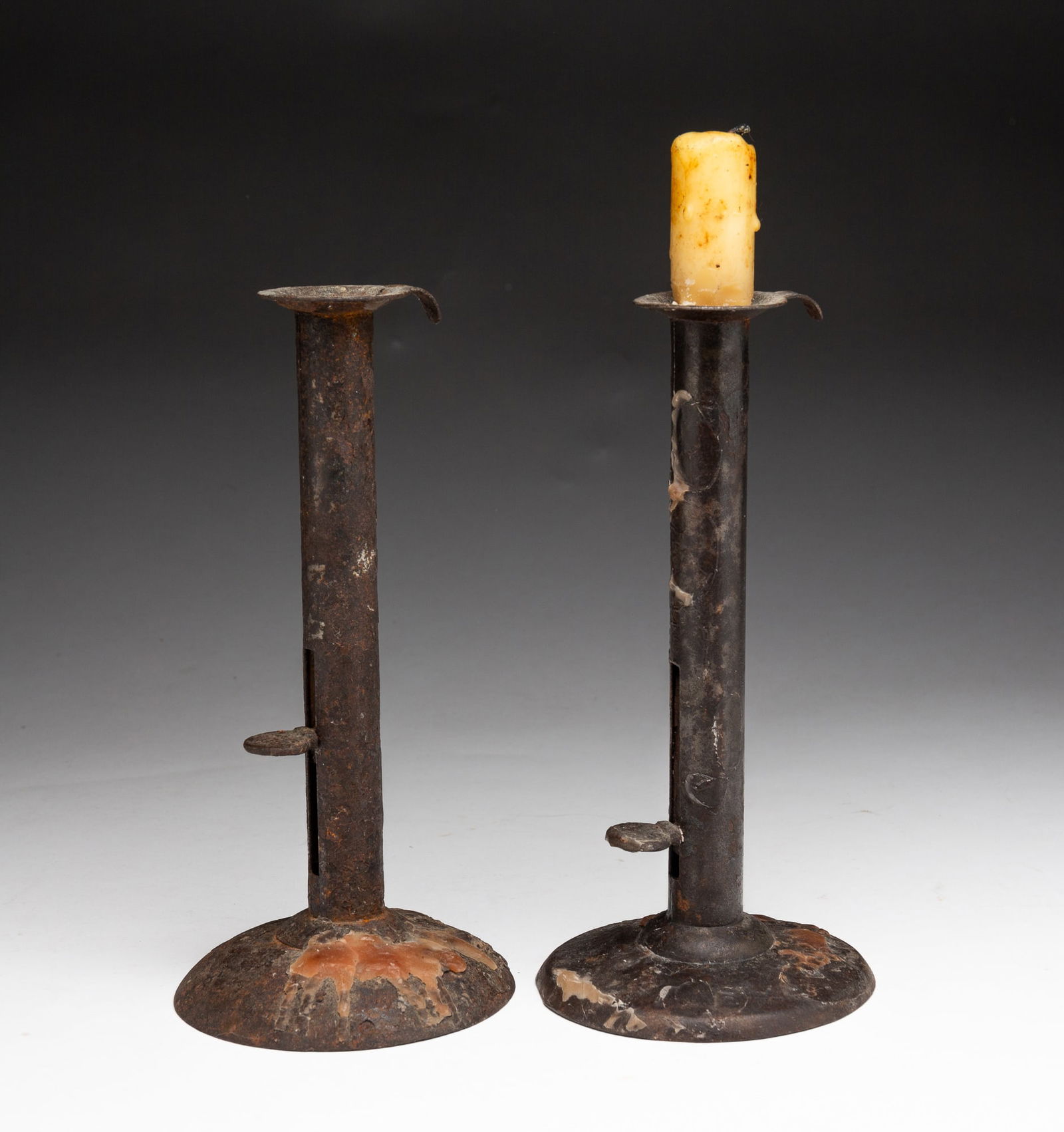FIVE AMERICAN IRON HOGSCRAPER CANDLESTICKS. (1 of 9)