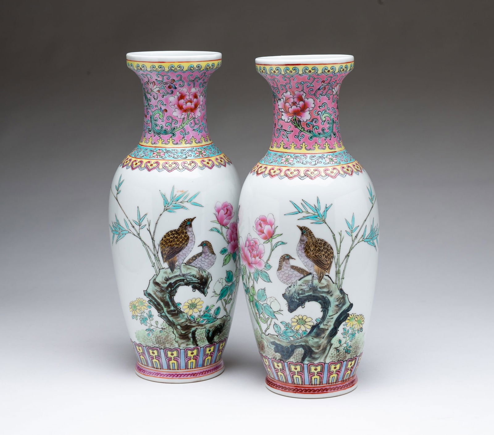 PAIR OF CHINESE FAMILLE ROSE PORCELAIN VASES. (1 of 6)