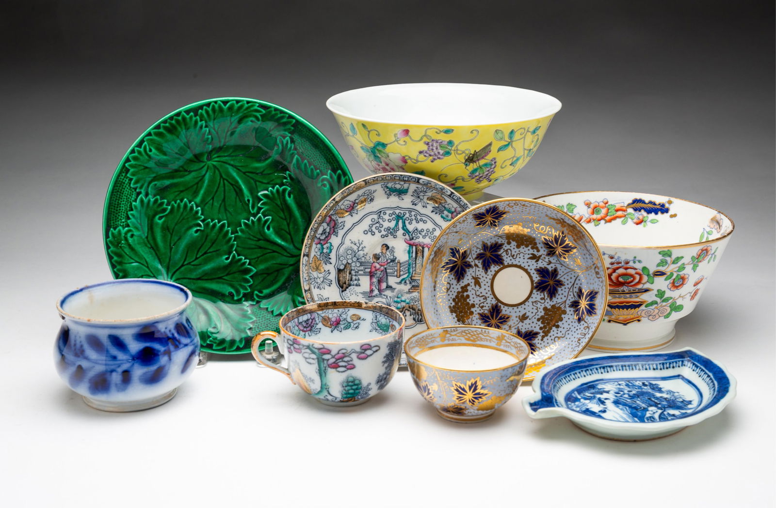 ECLECTIC GROUP OF NINE PORCELAIN BOWLS AND PLATES, INCL. CANTON LEAF DISH. (1 of 6)