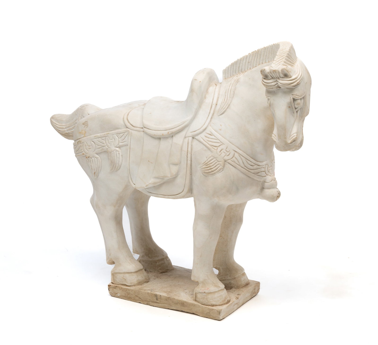 CHINESE CARVED WHITE MARBLE TANG-STYLE HORSE.: 20th Century. Standing horse with head turned to the right, adorned with saddle and reins, coiffed mane and tail, on a rectangular plinth base. 23.5"h. 26.5"l. 7.5"d.