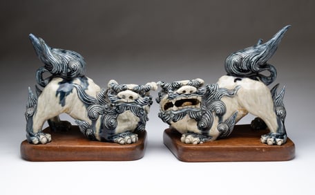 PAIR OF CHINESE GLAZED PORCELAIN FOO DOGS.