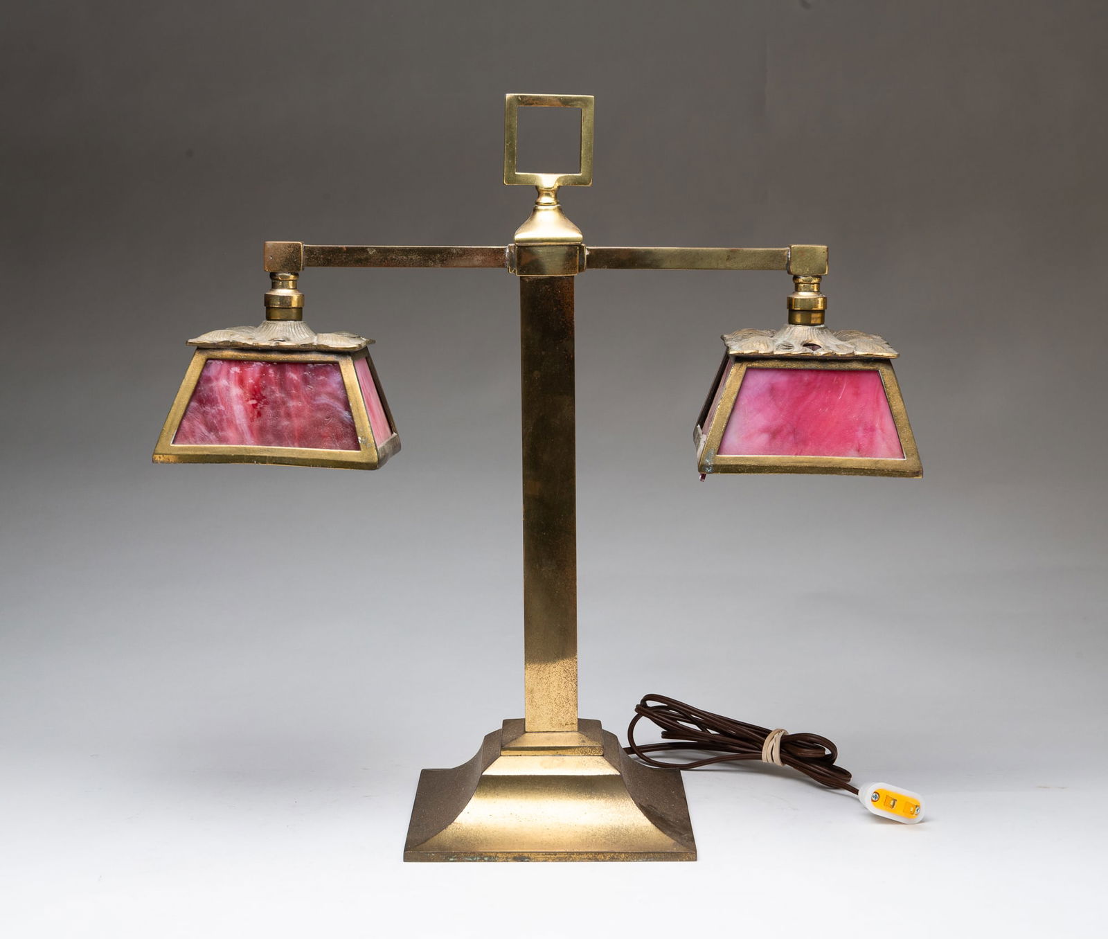 AMERICAN BRASS TWO-LIGHT DESK LAMP WITH PINK SLAG GLASS SHADES. (1 of 6)