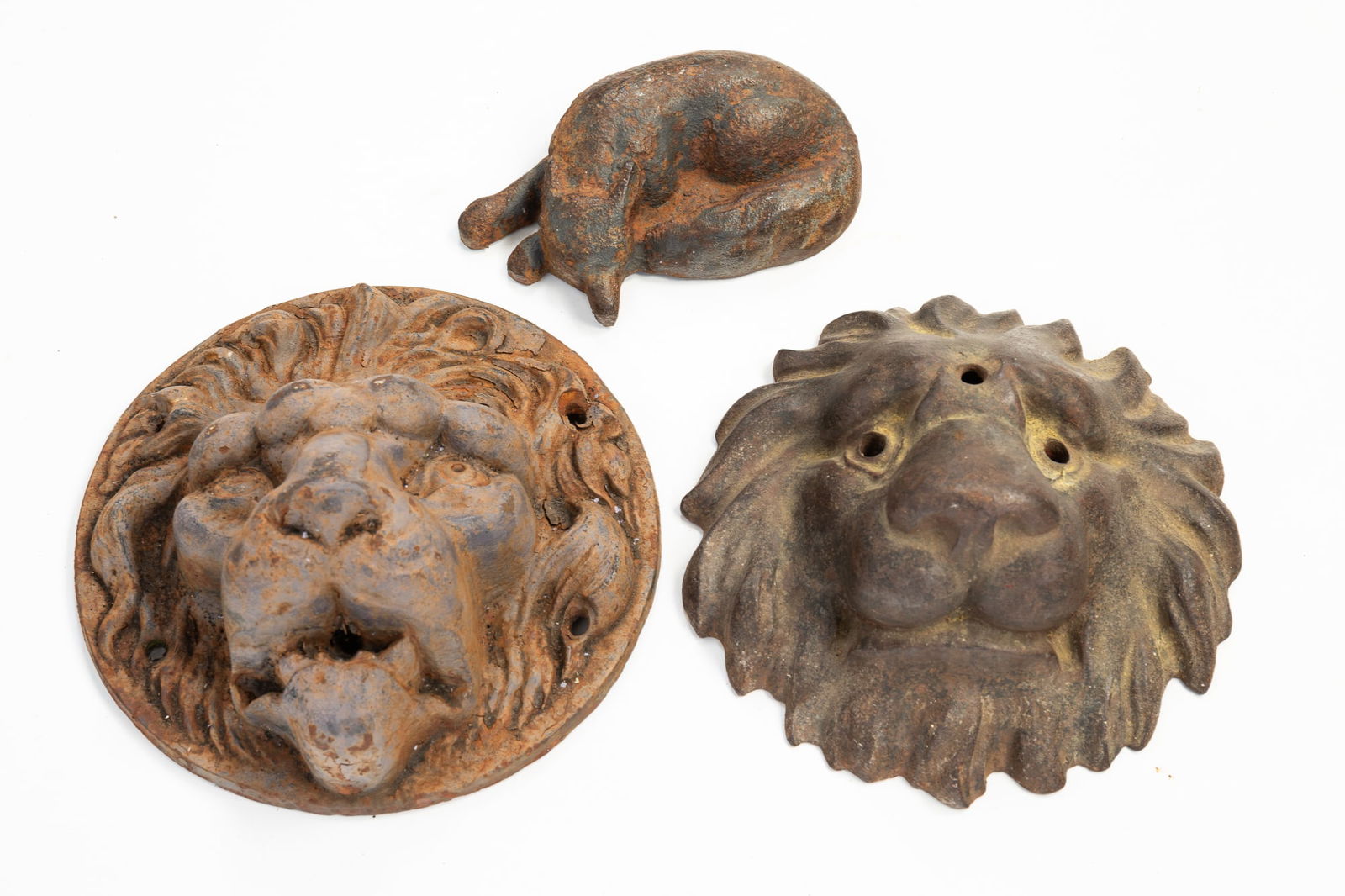 TWO LION'S HEADS AND A FOX IN CAST IRON. (1 of 5)