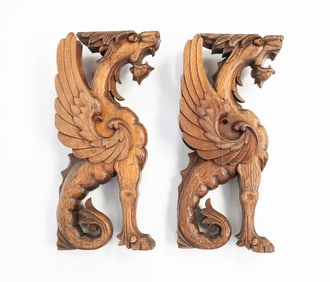 TWO EUROPEAN CARVED WALNUT GRIFFINS.