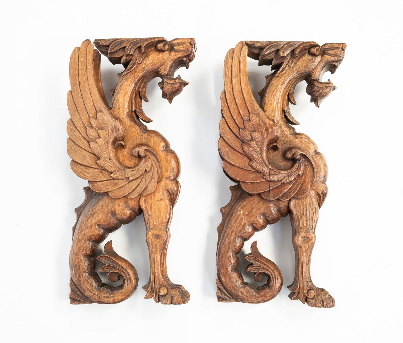 TWO EUROPEAN CARVED WALNUT GRIFFINS. (1 of 3)
