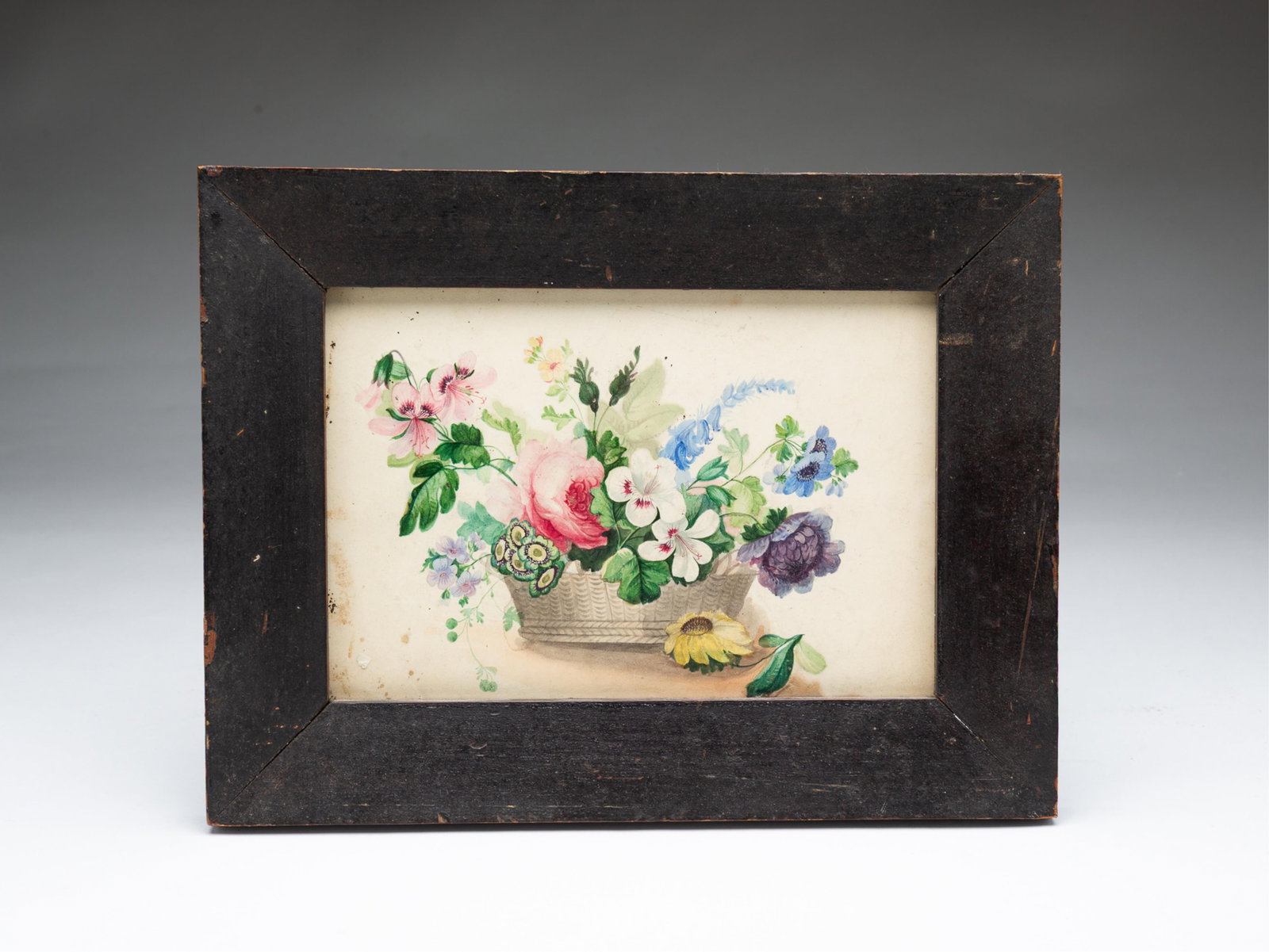 AMERICAN SCHOOL WATERCOLOR STILL LIFE OF A BASKET OF FLOWERS. (1 of 3)