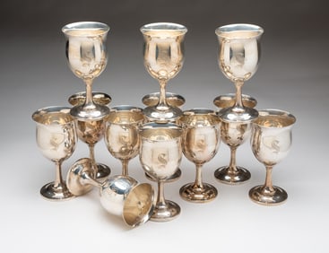 TWELVE REED AND BARTON STERLING SILVER GOBLETS.