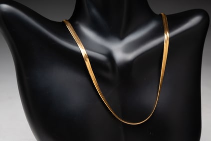 14K YELLOW GOLD HERRINGBONE NECKLACE.