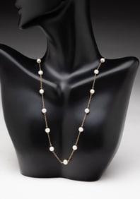 14K YELLOW GOLD PEARL STATION NECKLACE.