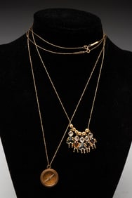 TWO 14K YELLOW GOLD PENDANT NECKLACES.