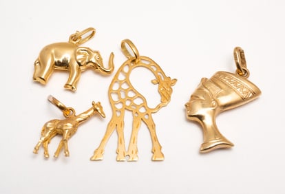 GROUP OF YELLOW GOLD PENDANTS.