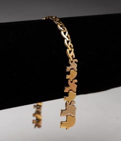 18K YELLOW GOLD ELEPHANT BRACELET NEEDS REPAIR.