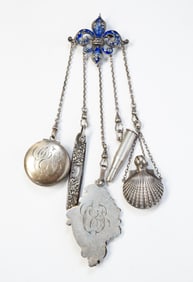 EUROPEAN ENAMELED AND STERLING SILVER CHATELAINE WITH STERLING CHARMS.