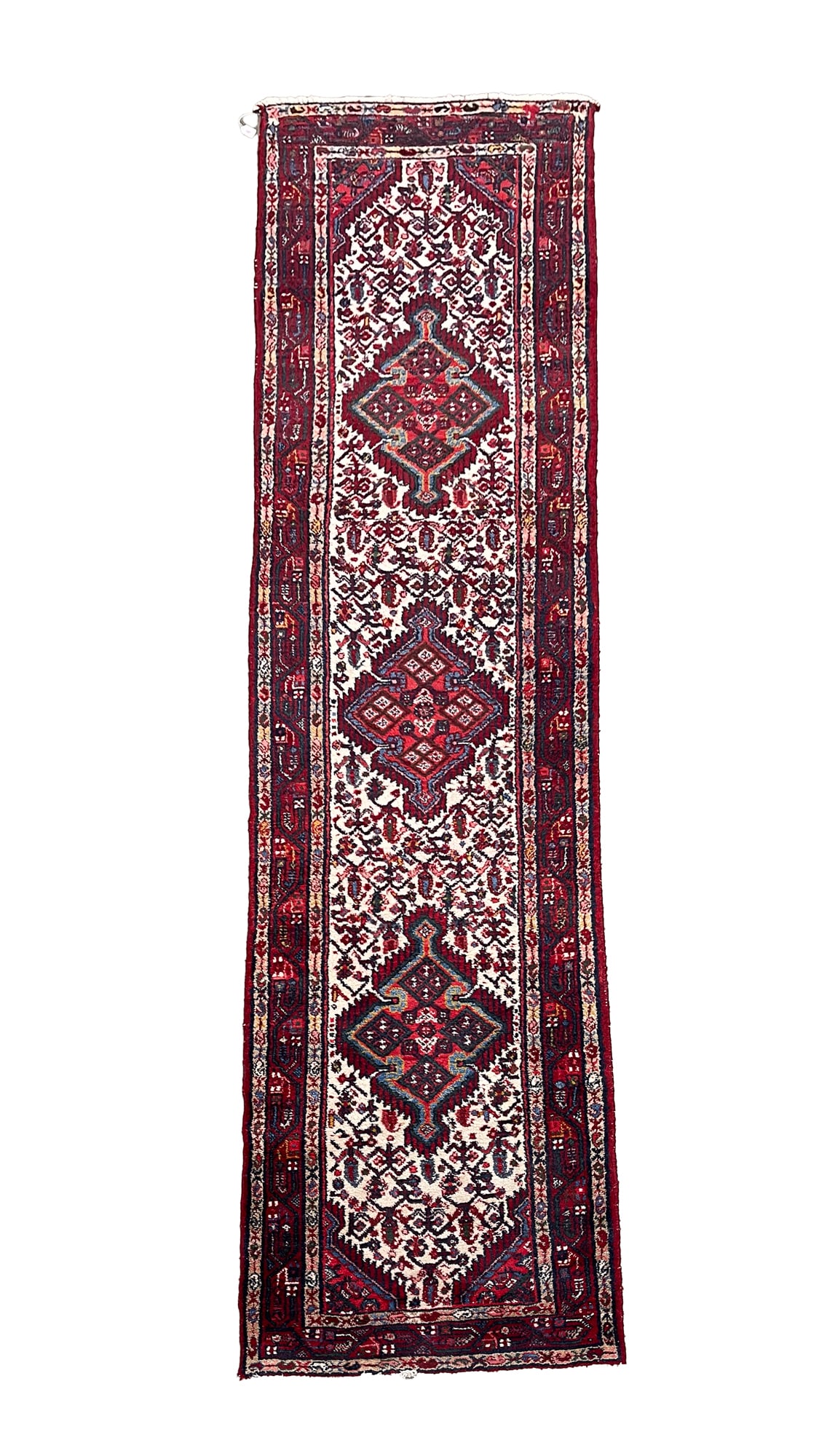 ORIENTAL WOOL RUNNER.: 20th Century. Hand-knotted. Triple medallion center, cream field, red and tan borders and multi-colored overall floral pattern. 2' 8"w. 10' 3''l.Provenance: From the Lifetime Collection of the late Da