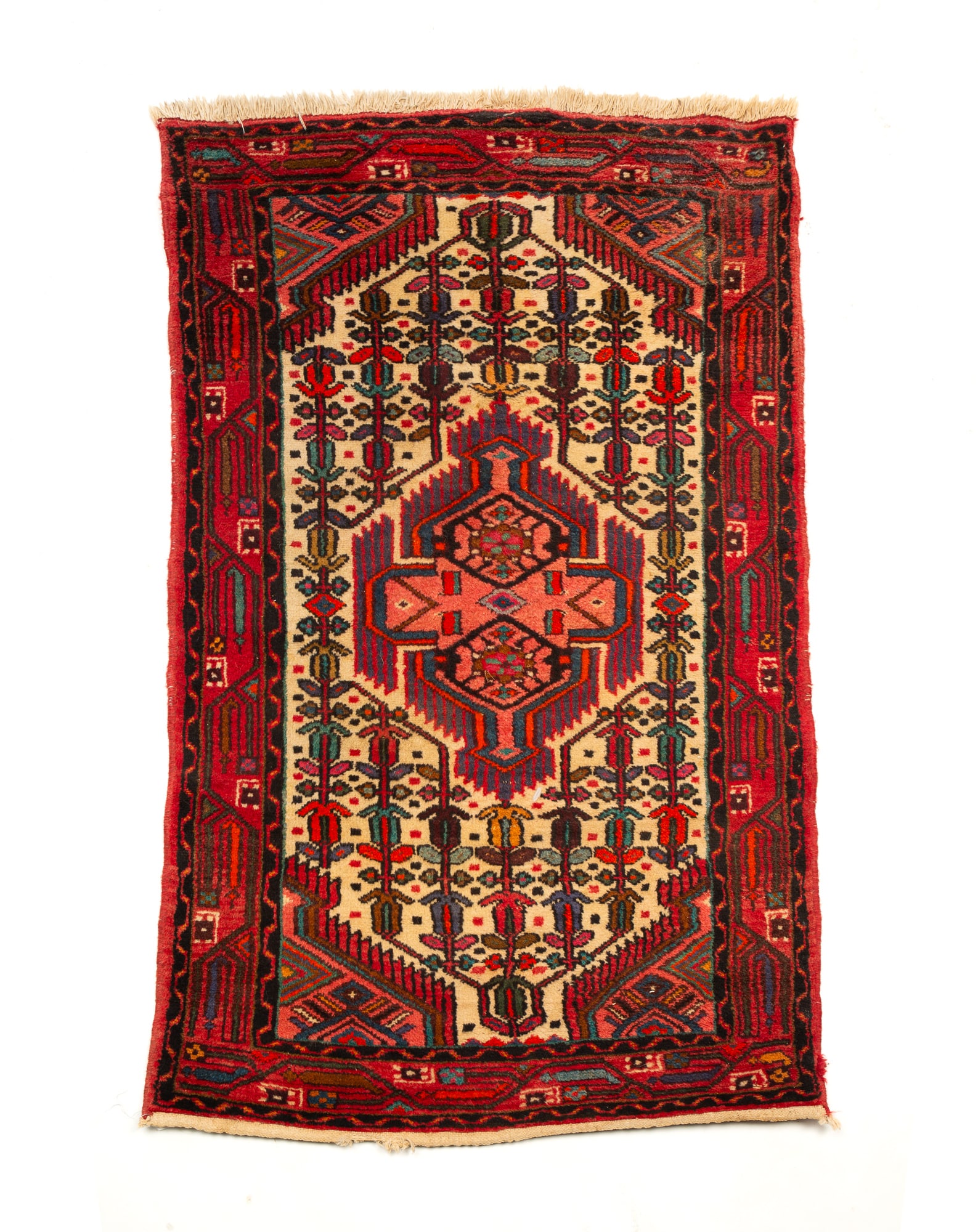 CAUCASIAN SCATTER RUG.: Second half 20th Century. Wool. Center medallion, cream field, black and red borders with multi-colored geometric pattern. 2'6.5"w. 4'l.
