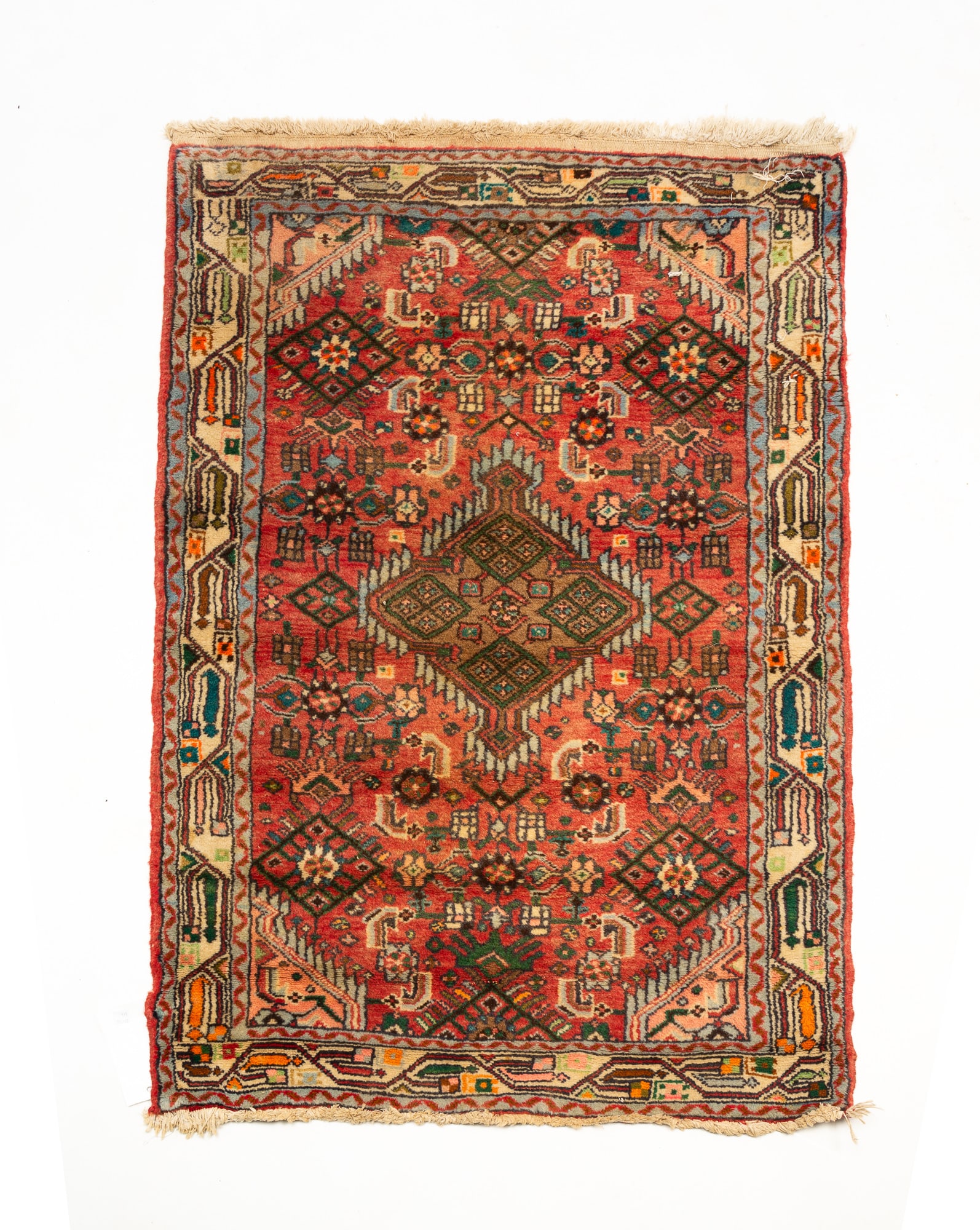 CAUCASIAN SCATTER RUG.: Late 20th Century. Wool. Diamond-shaped medallion, dark coral field, blue and cream borders with an overall multi-colored geometric pattern. 2'9.5"w. 4'l.