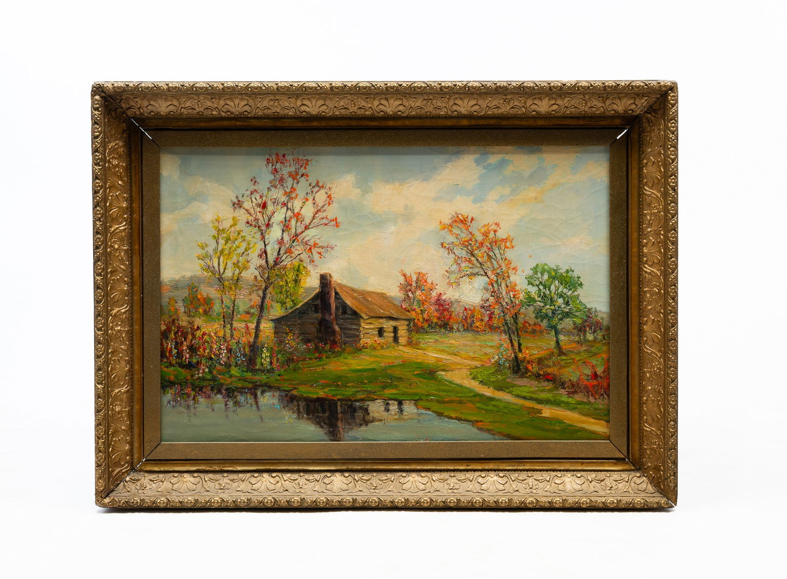 AMERICAN SCHOOL OIL ON CANVAS OF COUNTRY LANDSCAPE.: Late 19th Century. Country landscape with a log cabin near a pond with a tree-lined background. Unsigned. In an ornate giltwood frame. Frame 26.5"h. 37"w. Canvas, 20"h. 30"w.