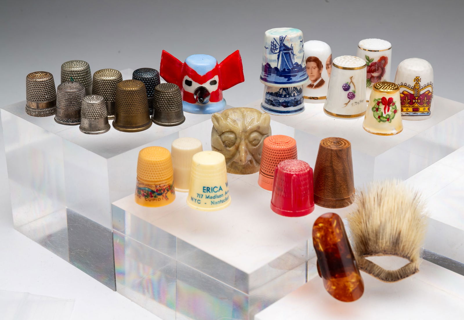 COLLECTION OF TWENTY-THREE THIMBLES AND TWO FINGER GUARDS, INCL. NATIVE AMERICAN SEAL FUR. (1 of 7)