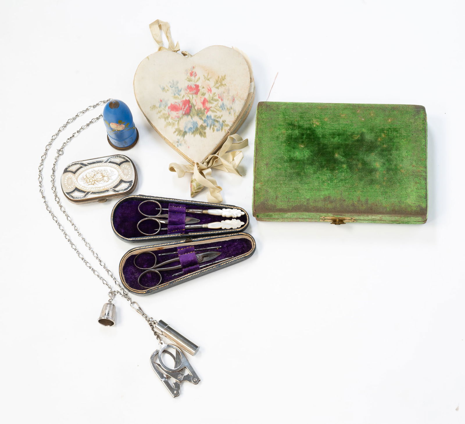 COLLECTION OF SIX SEWING KITS AND CASES.: Various nationalities, 19th-20th Century. Sewing kit in green velvet box, Enco painted wood cylinder "Sew Kit," sewing kit in navy blue case having a silver shield monogrammed "ARS," sewing kit in