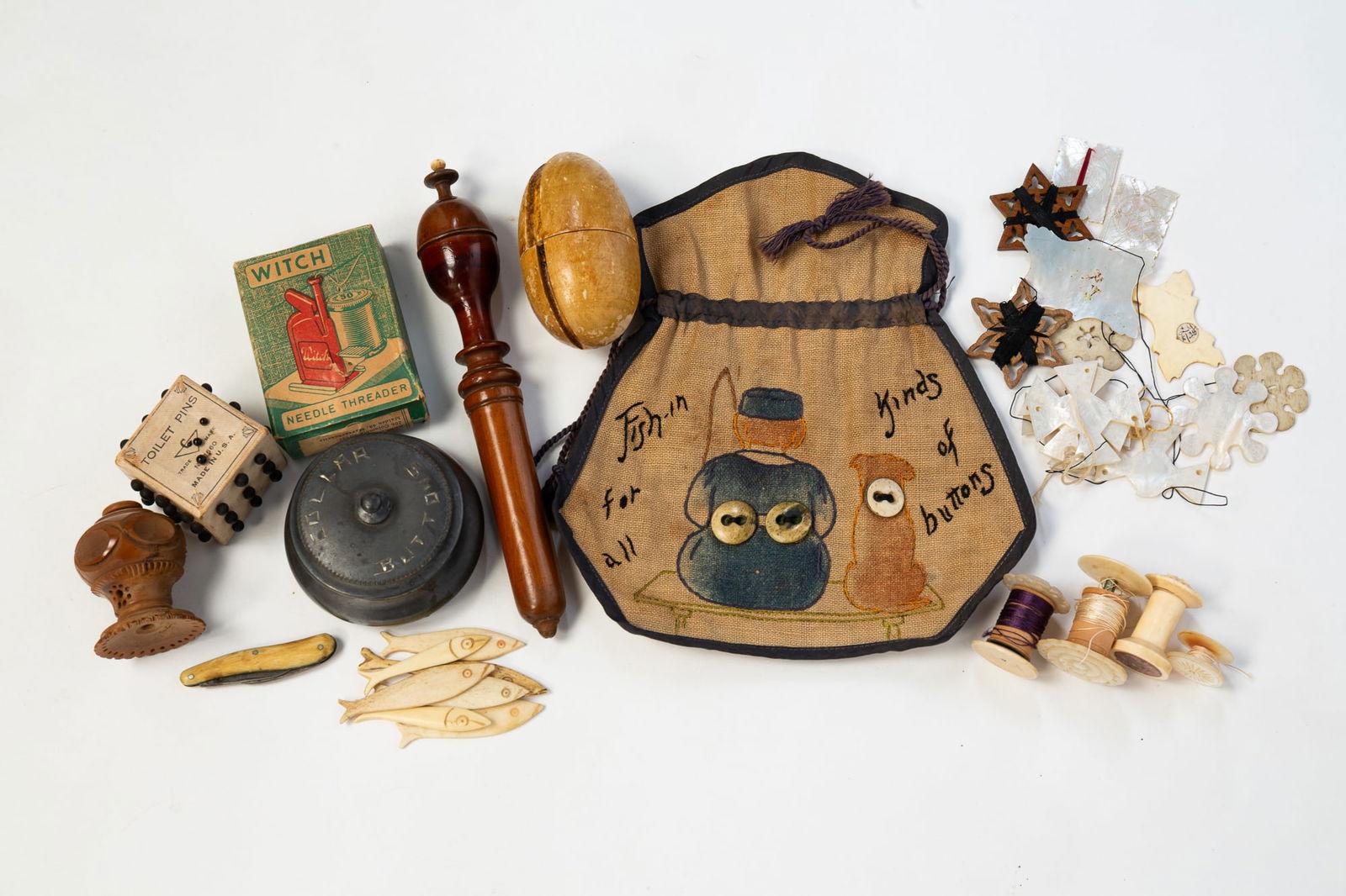 COLLECTION OF THIRTY-TWO THREAD CASES, HOLDERS, AND SEWING ITEMS. (1 of 5)