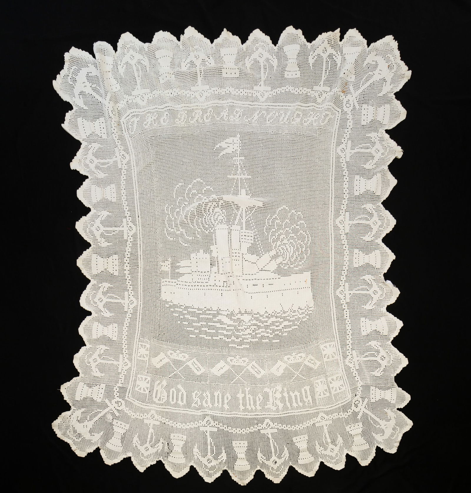 ENGLISH CROCHETED COTTON TABLECLOTH WITH NAUTICAL THEME.: Ca.1900. Border of capstans and anchors, center with dreadnaught naval ship, "The Dreadnought" above ship and below "God Save The King", British flags and crowns over crossed flags.Provenance: From