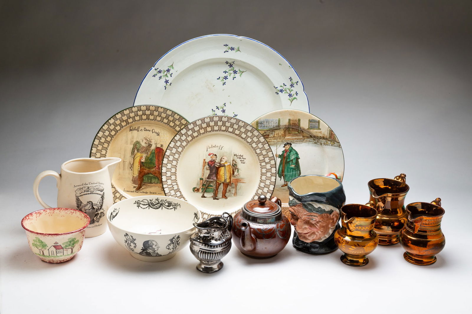 COLLECTION OF CHINA, INCL. ROYAL DOULTON.: 19th-20th Century. Three copper luster cream pitchers. Silver luster creamer. Charger with Floral sprig pattern and blue rim. Gown and entwined C's mark. Three Royal Doulton plates: Falstaff and Tony