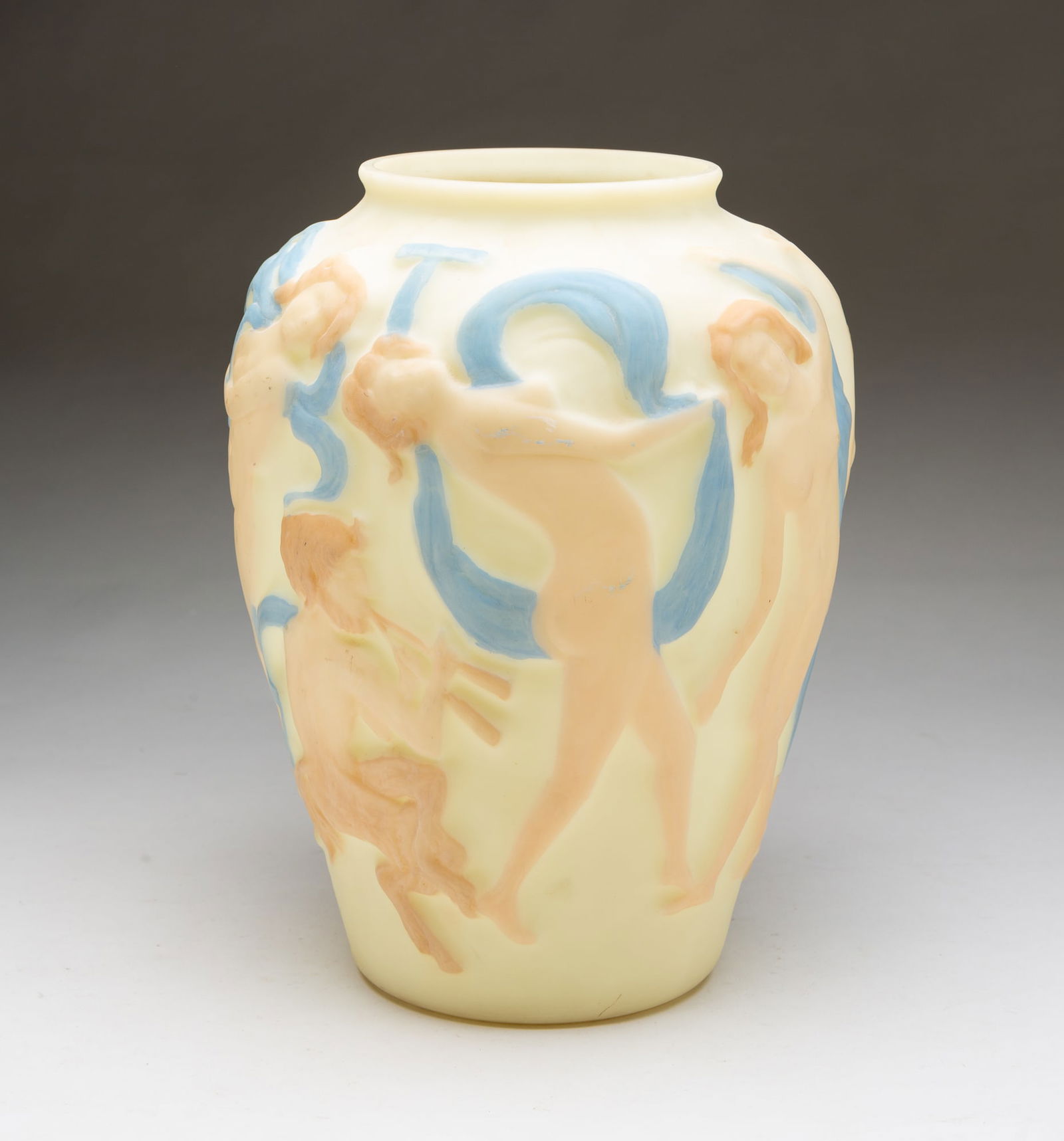 AMERICAN PHOENIX CUSTARD GLASS VASE WITH EMBOSSED DANCING LADIES.: Second half 20th Century. Custard glass with embossed dancers in flesh tones and sky blue scarves. 12"h.