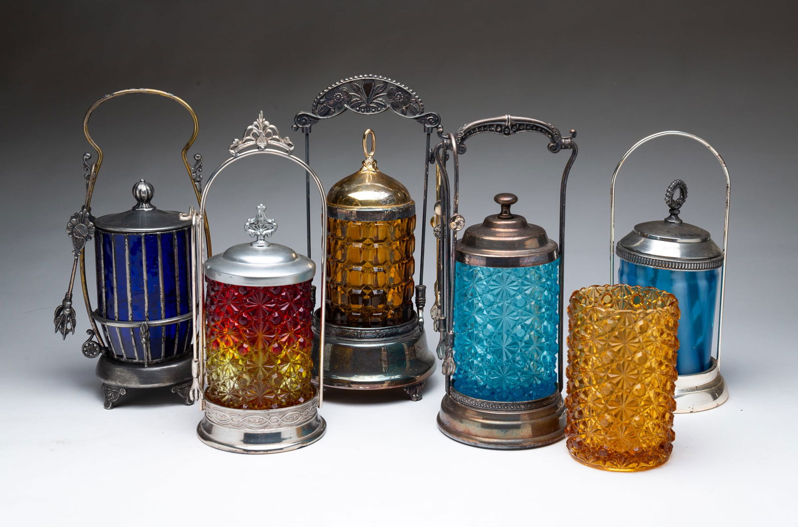 SIX AMERICAN COLORED GLASS PICKLE CASTERS. (1 of 6)
