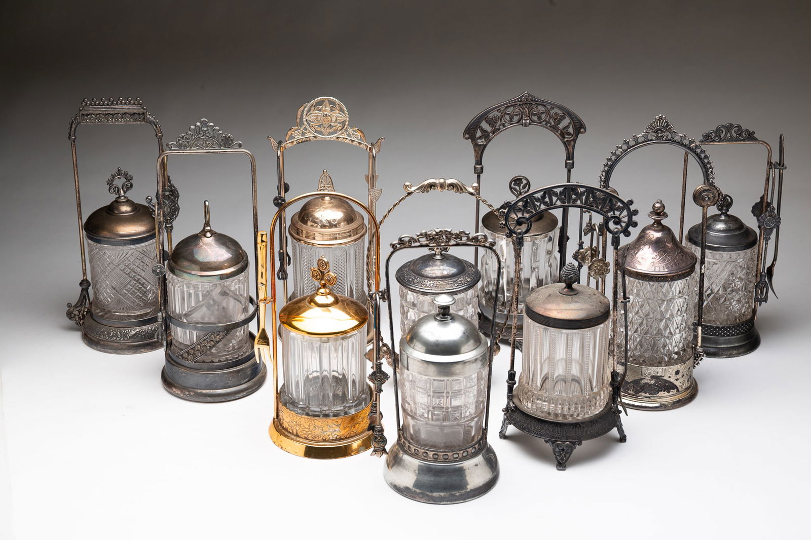 NINE AMERICAN PATTERN GLASS PICKLE CASTERS. (1 of 7)