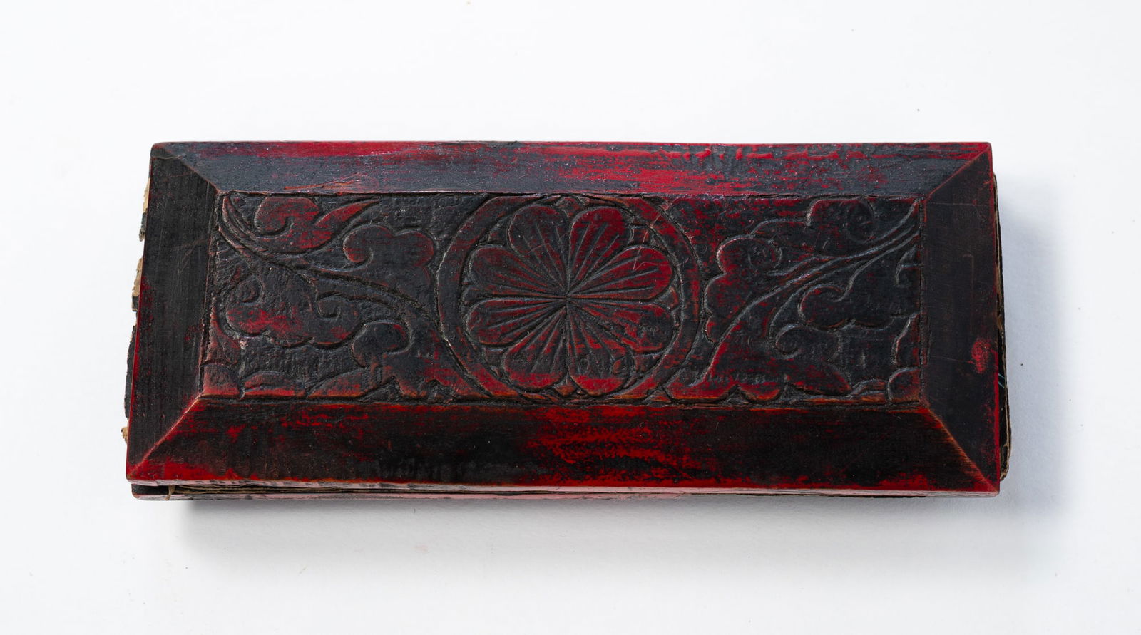 NEPALESE BUDDHIST MANUSCRIPT WITH CARVED AND LACQUERED WOOD COVERS. (1 of 3)