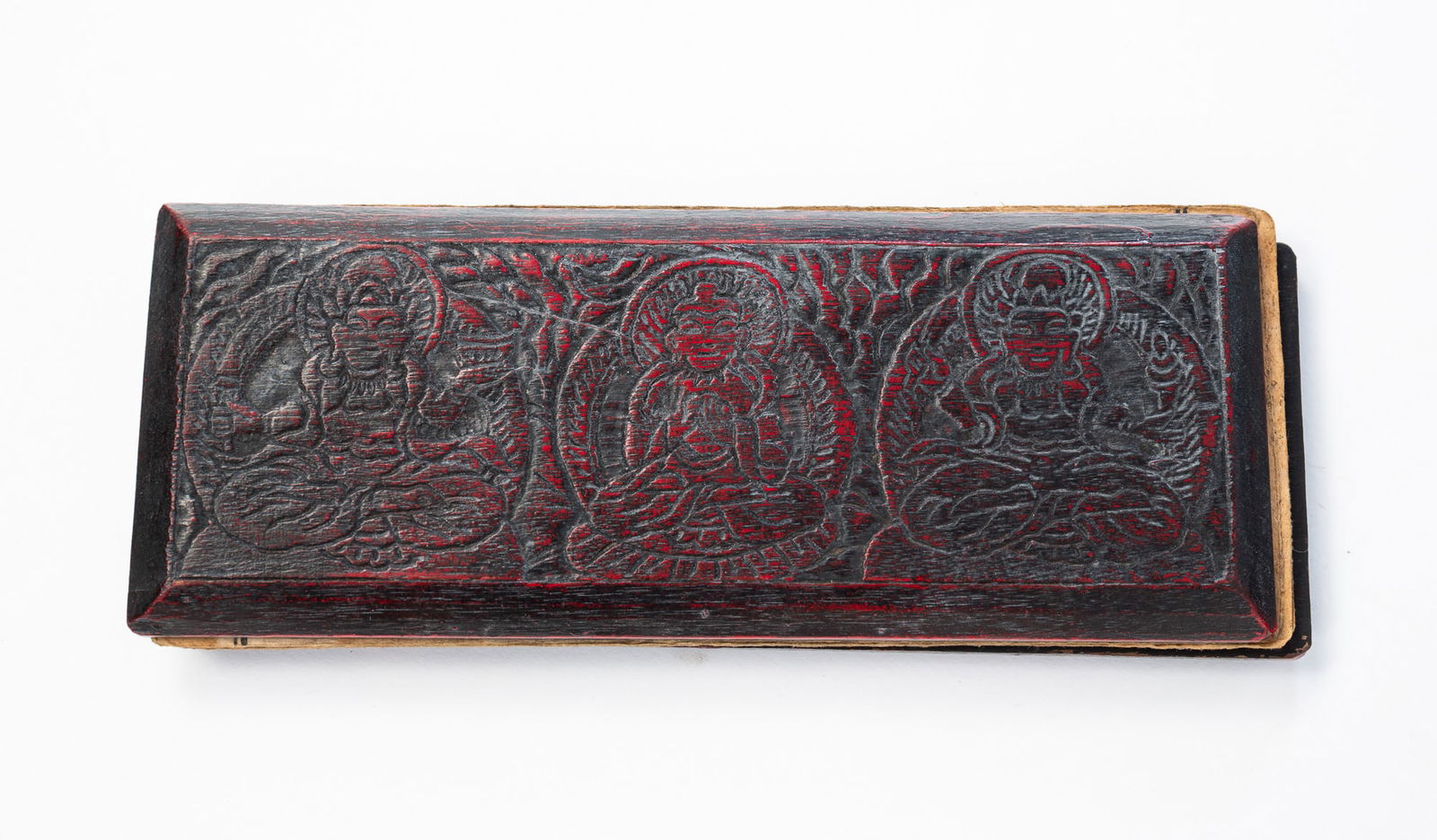 BUDDHIST MANUSCRIPT WITH CARVED AND LACQUERED WOOD COVERS. (1 of 5)