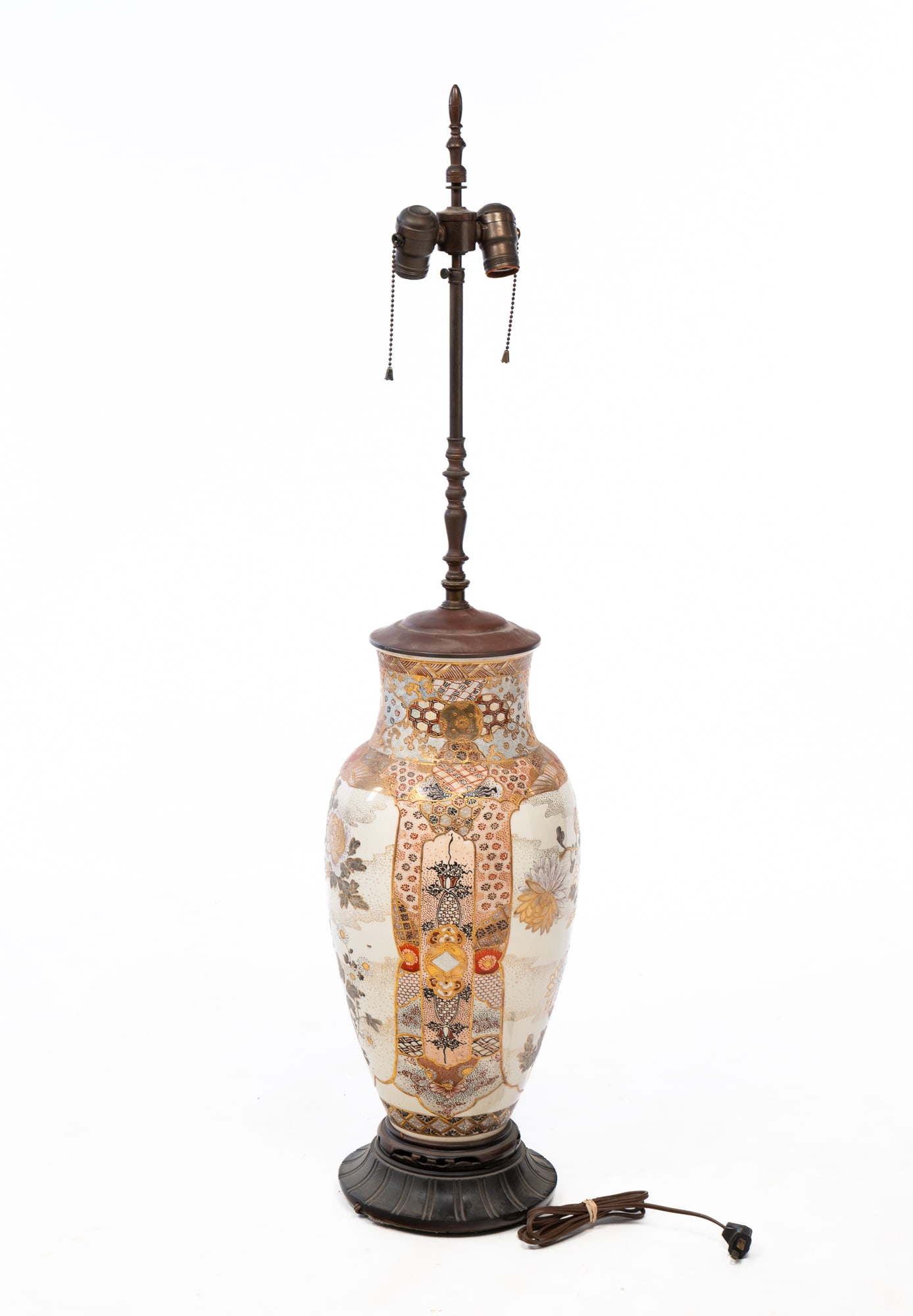 LARGE JAPANESE SATSUMA PORCELAIN VASE MOUNTED AS A LAMP.: Ca. 1900 and adapted. Of baluster form, painted with chrysanthemums and intricate botanical and geometric designs on an ivory ground, mounted with a double light socket with finial and on a pierced