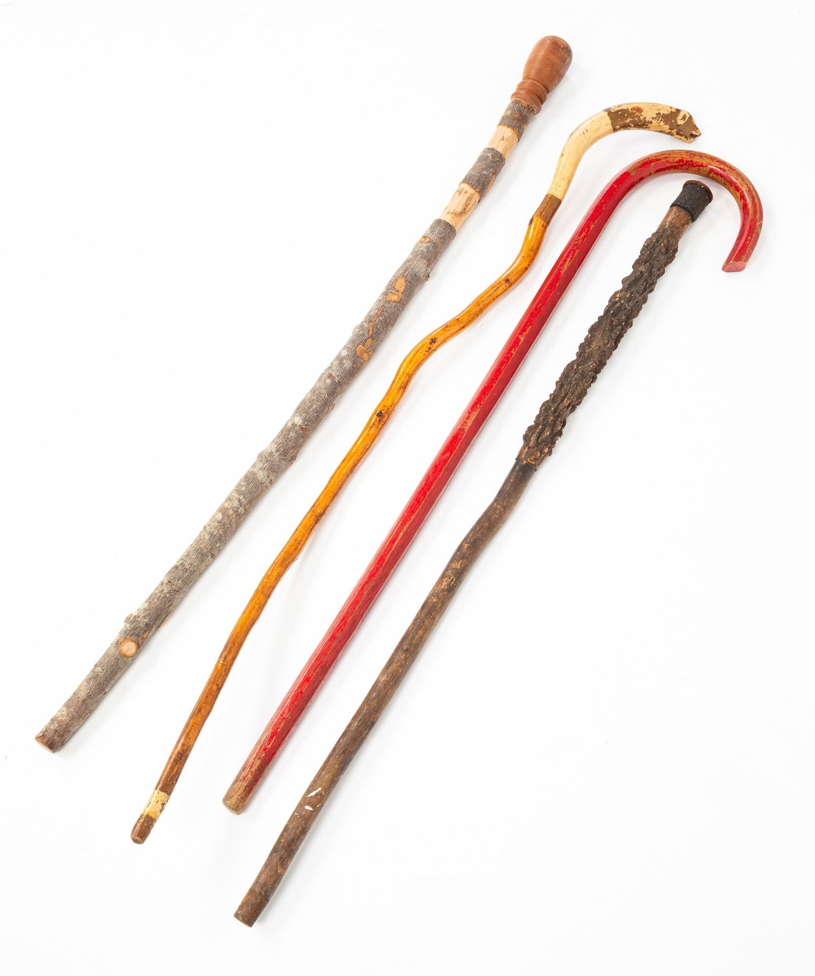 FOUR AMERICAN FOLK ART CARVED WALKING STICKS AND CANES. (1 of 4)