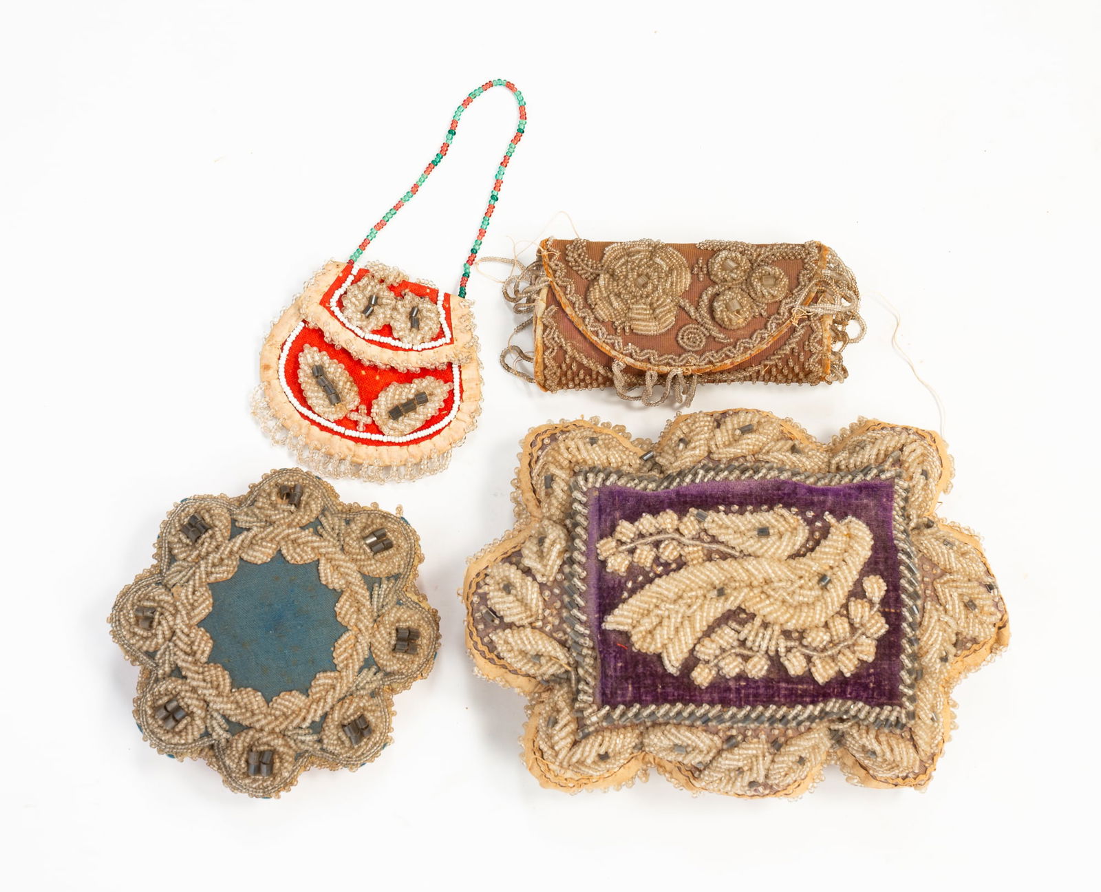 THREE NATIVE AMERICAN BEADED PIN CUSHIONS AND A MINIATURE BEADED PURSE. (1 of 3)