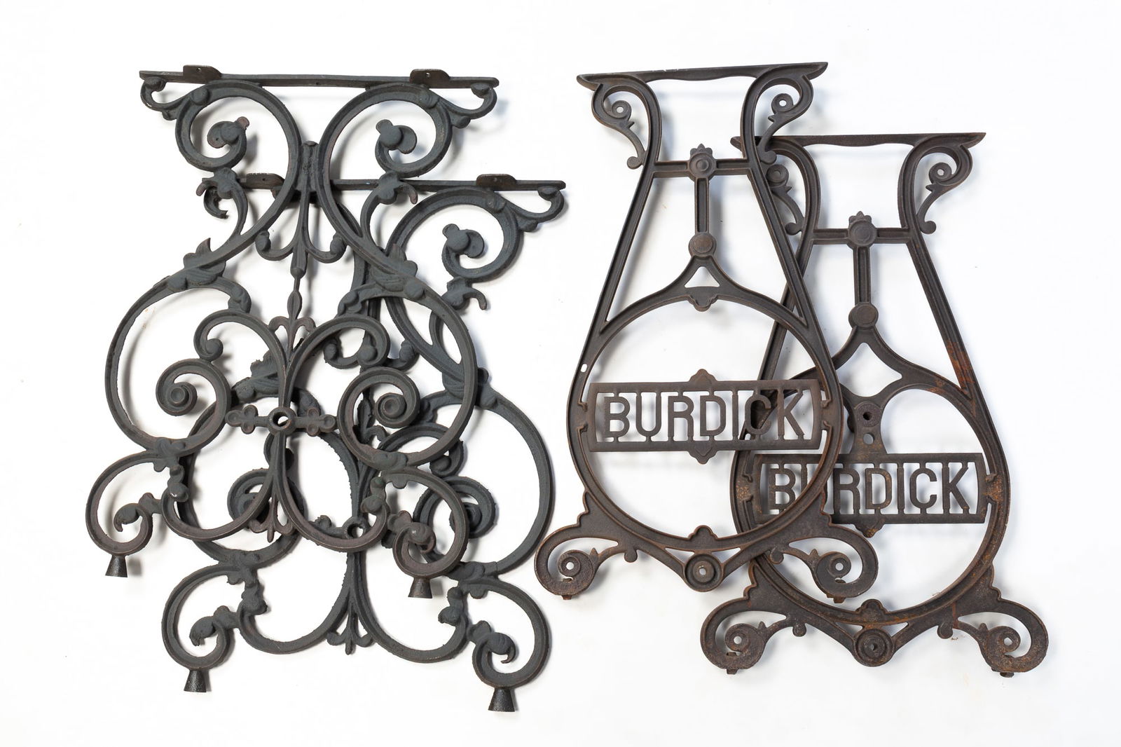 TWO PAIRS OF CAST IRON TREADLE SEWING MACHINE BASES. (1 of 3)