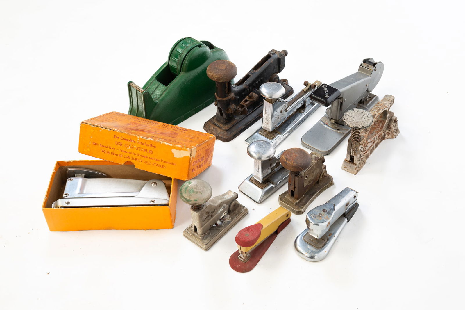COLLECTION OF NINE STAPLERS AND A TAPE DISPENSER. (1 of 7)