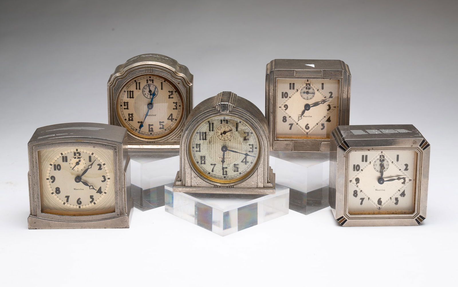 FIVE WESTCLOX (LA SALLE, ILLINOIS) ART DECO ALARM CLOCKS WITH CASES BY DURA (TOLEDO, OHIO). (1 of 9)