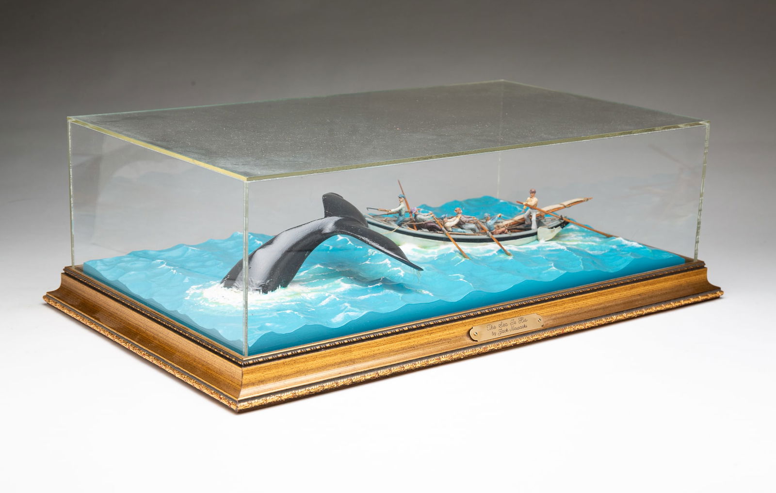 JACK NOWACKI (AMERICAN, 1921-2009) "THE SEA IS HIS" SCULPTURE OF A BOAT AND WHALE. (1 of 5)