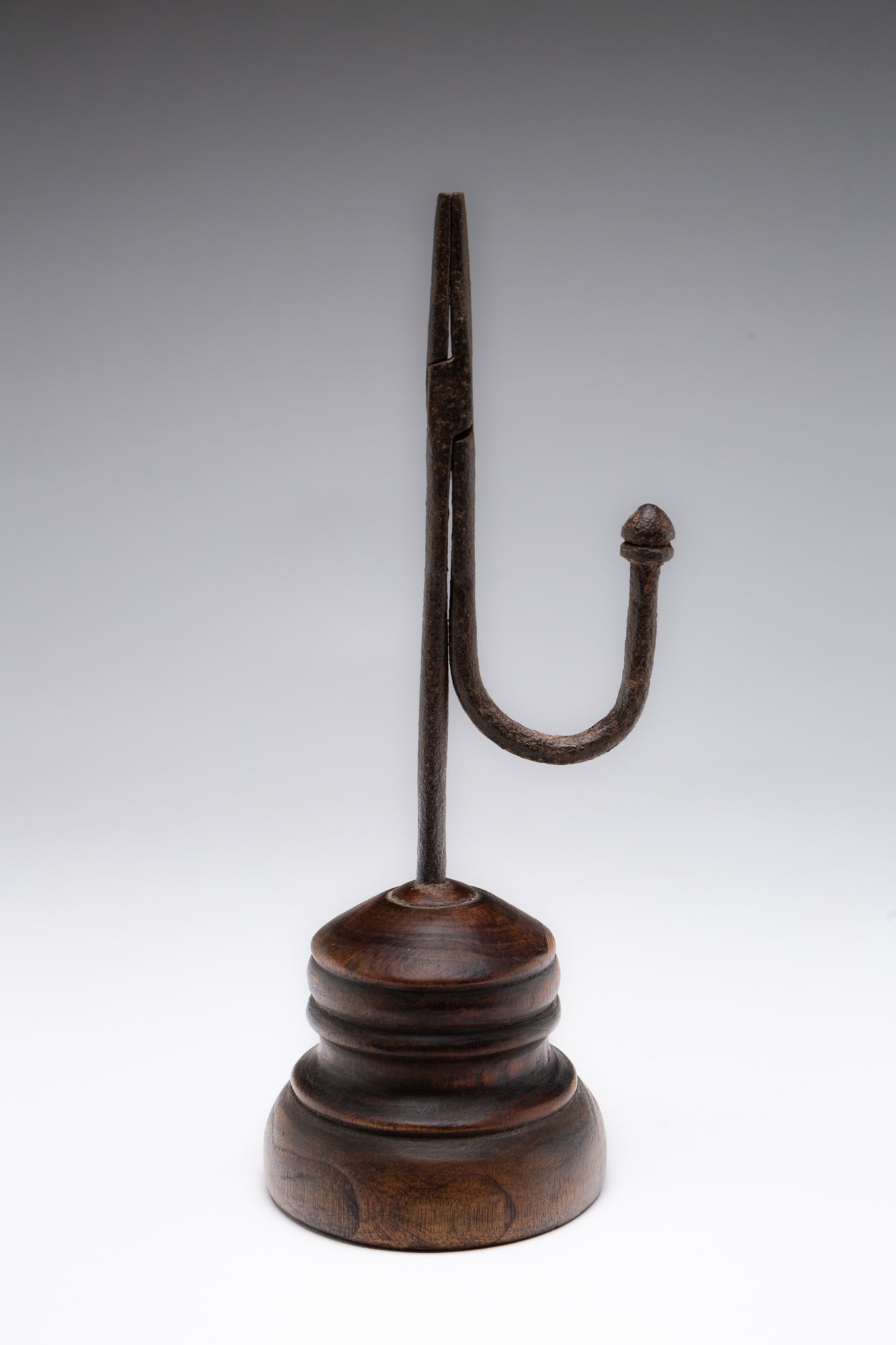 AMERICAN WROUGHT IRON TABLETOP RUSH LIGHT CANDLEHOLDER WITH TURNED WOOD BASE. Approximately 10.5"h. (1 of 4)