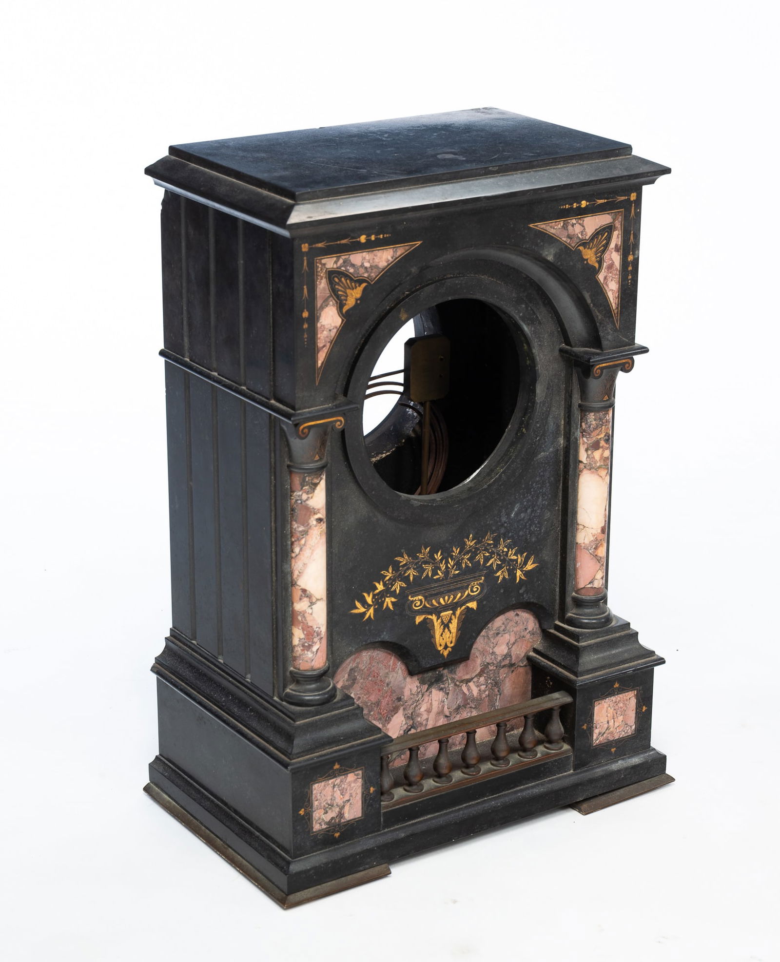 EUROPEAN SLATE, MARBLE, AND GILT-DECORATED MANTEL CLOCK CASE. 19.5"h. 14"w. 8.5"d. Approx. 80 lbs.: Late 19th Century. Heavy slate case decorated with gold leaves, pink marble panels and columns, and balcony like gallery to bottom.Provenance: From the Collection of Mark and Sandy Keily.SHIPPING: All