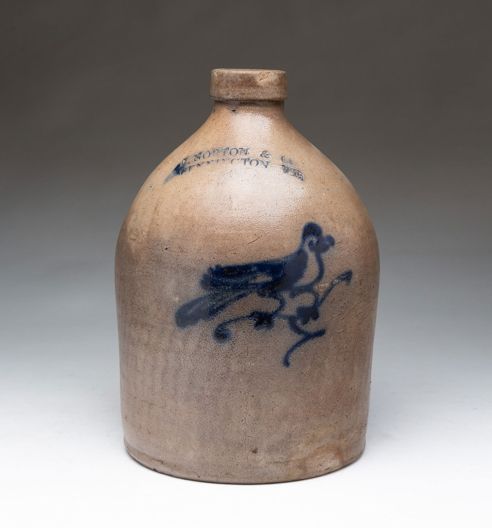 J. NORTON (BENNINGTON, VERMONT) COBALT-DECORATED STONEWARE JUG WITH FREEHAND BIRD-ON-BRANCH. (1 of 5)