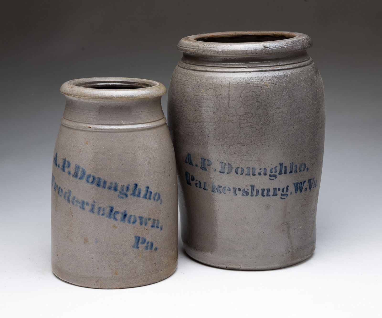TWO A.P. DONAGHHO (PENNSYLVANIA AND WEST VIRGINIA) COBALT-DECORATED STONEWARE CANNING JARS. Largest, (1 of 5)