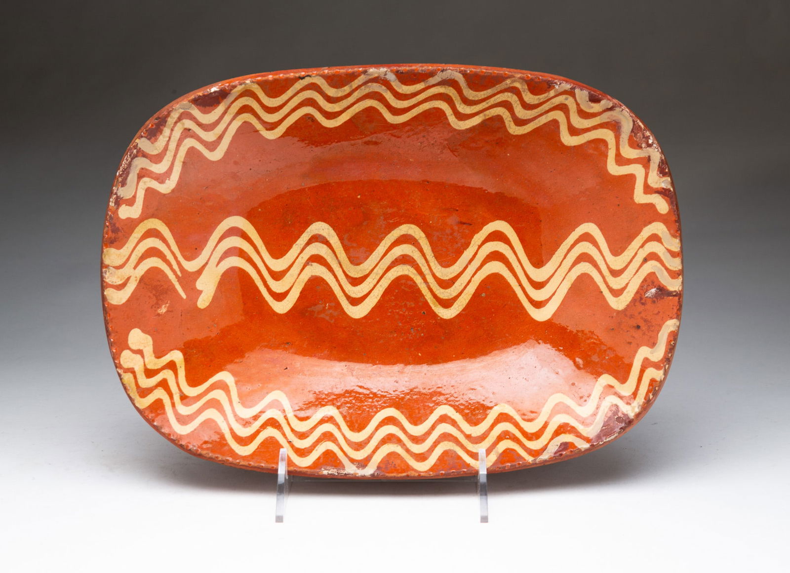 AMERICAN REDWARE LOAF PAN WITH SLIP DECORATION. 3"h. 13.75"w. 10"d. (1 of 3)