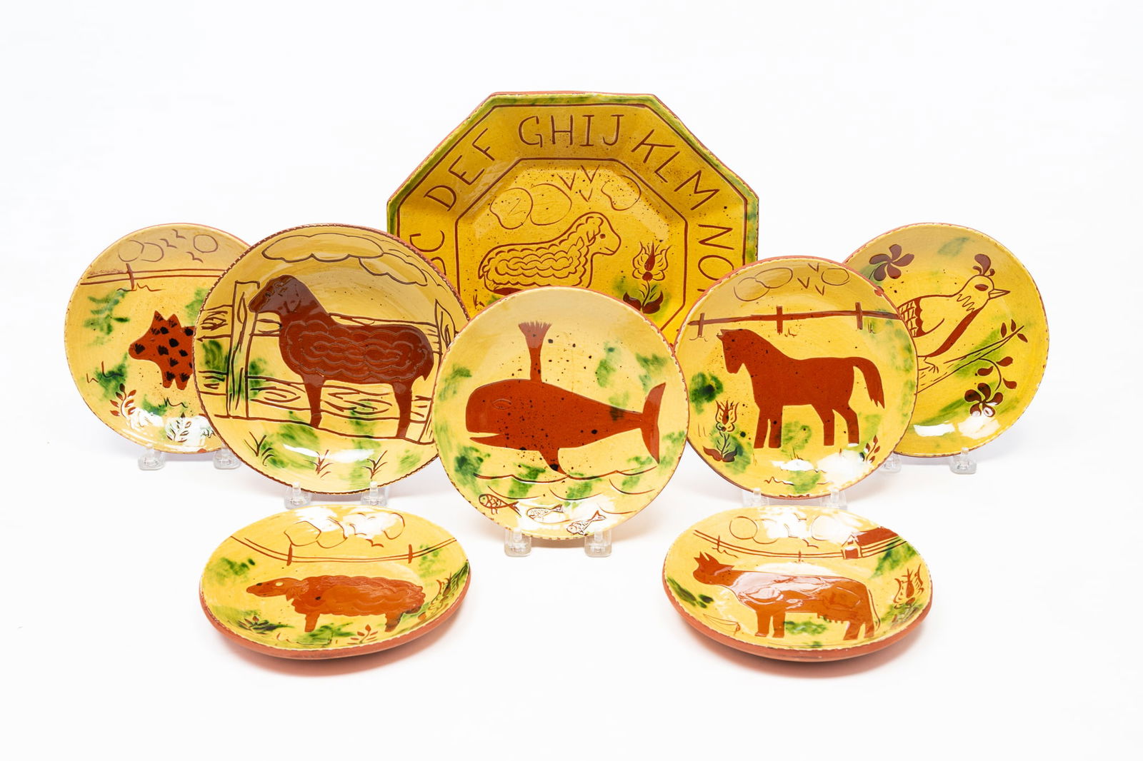 EIGHT BREININGER POTTERY (ROBESONIA, PENNSYLVANIA) REDWARE PLATES. Largest, 16.75"d. (1 of 10)