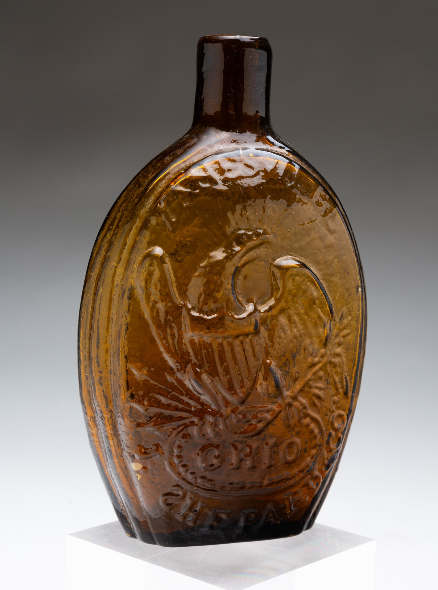J. SHEPPARD AND CO. (ZANESVILLE, OHIO) AMBER GLASS EAGLE FLASK. 6.5"h. (1 of 3)